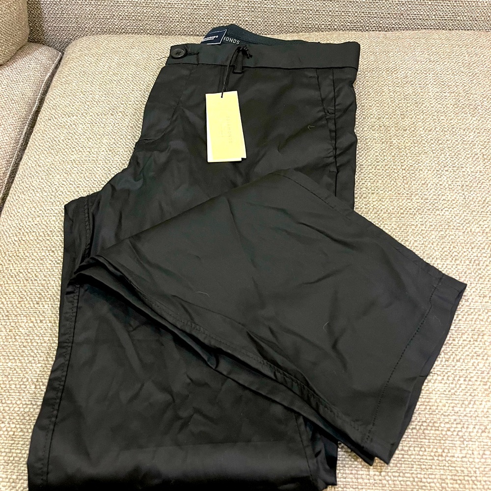 Brand new 7Diamond performance pants in size 30/32.  Versatile navy fabric.